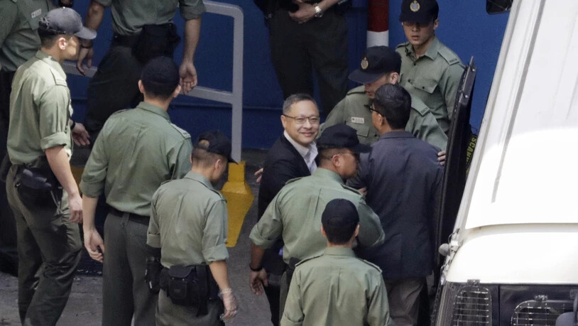 Der Juradozent Benny Tai und der Sozialwissenschaftler Chan Kin-Man (r) müssen für 16 Monate ins Gefängnis.