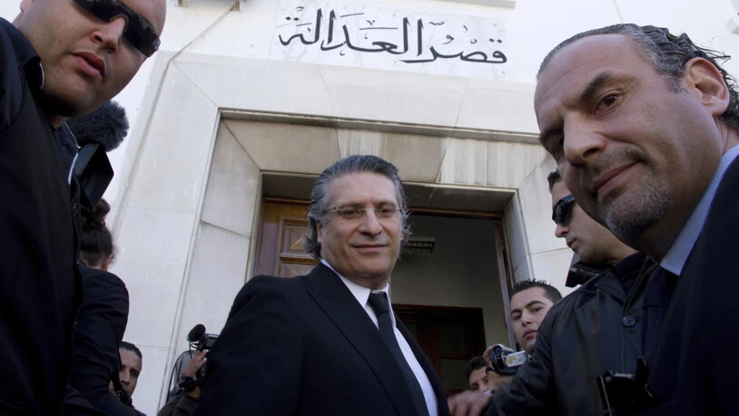 Derzeit im Gefängnis: Medienmogul Nabil Karoui (Mitte) hat es trotzdem in die Stichwahl um die tunesische Präsidentschaft geschafft. (Archiv)