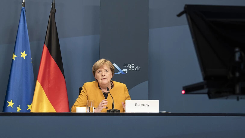 HANDOUT - Angela Merkel, Bundeskanzlerin, nimmt im Rahmen des beim virtuellen G20-Gipfel an einer Videokonferenz im Kanzleramt teil. Foto: Guido Bergmann/Bundesregierung/dpa - ACHTUNG: Nur zur redaktionellen Verwendung im Zusammenhang mit der aktuellen…