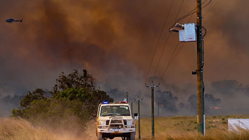 *FILE IMAGE* A supplied image shows firefighters working at the site of the Red Gully bushfire near Gingin, north of Perth, Tuesday, January 5, 2021. (AAP Image/Supplied by the Department of Fire and Emergency Services, Evan Collis) NO ARCHIVING