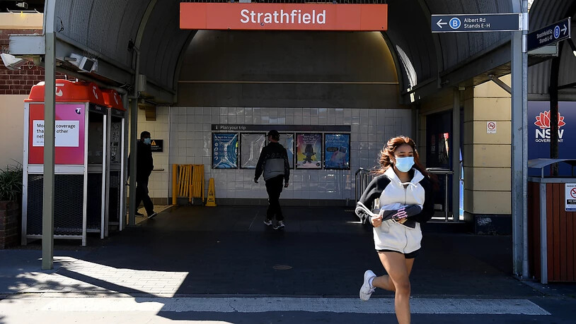 People are seen in Strathfield, Sydney, Friday, August 13, 2021. More than 80 per cent of the NSW population is now in lockdown as the state struggles to stop the spread of the Delta COVID-19 strain beyond Greater Sydney and into the regions. (AAP Image…