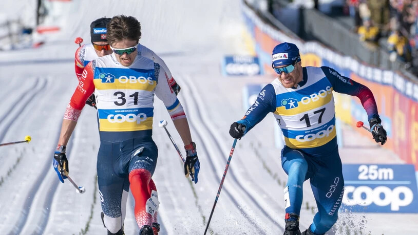 Dario Cologna (Nummer 17) gibt alles: Der Ausfallschritt beim Fotofinish zahlt sich aus.