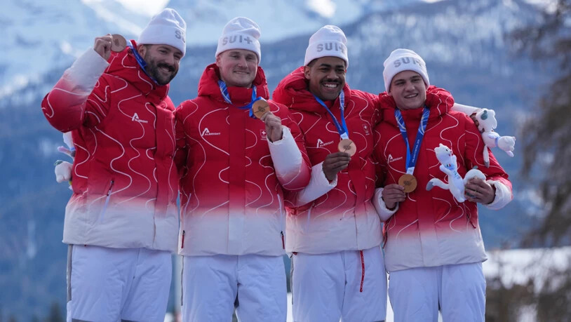 Michael Vogt, Andreas Haas, Amadou Ndiaye and Mario Aeberhard (von links) trotzen mit Olympia-Bronze der deutschen Bob-Phalanx
