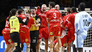 Triple geschafft: Dänemarks Handballer jubeln.